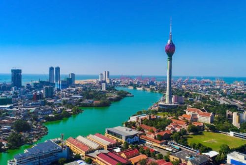View of the Colombo city skyline with modern architecture buildings including the lotus towers. during sunset